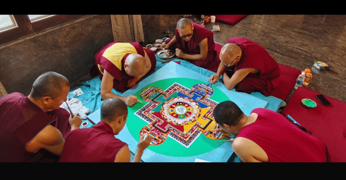 Monks creating a sand mandala during a World Peace Tour residency
